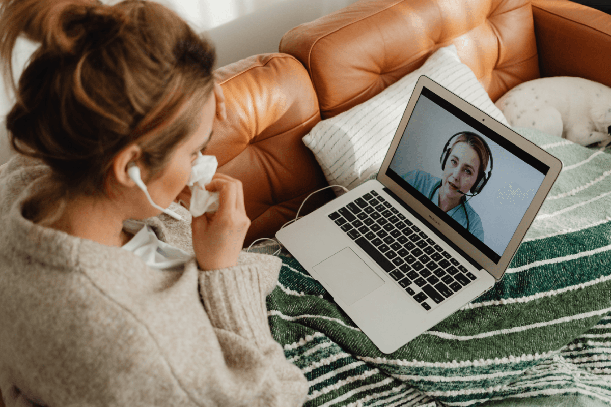 Person meeting with a therapist through a telehealth session