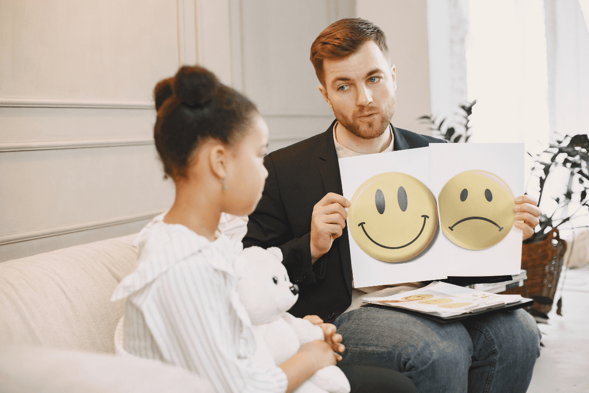 Therapist supporting a child in a counseling session